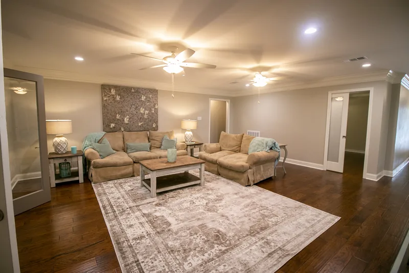 Remodeled living room with fireplace and hardwood floor