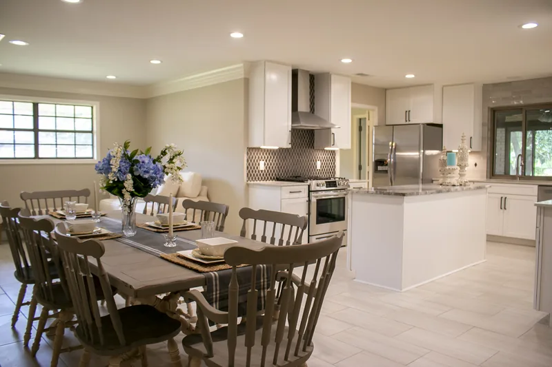 Open-plan white kitchen and dining area
