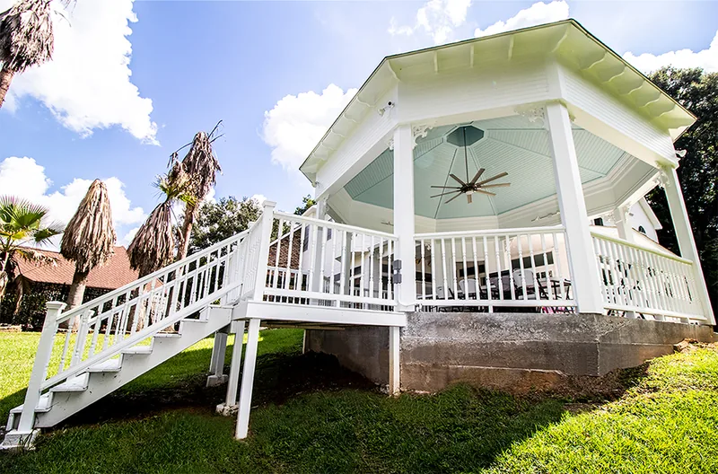 White custom gazebo with stairs and railings